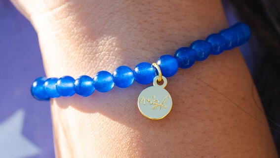 wish kid with bracelet