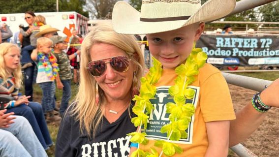 Volunteer Beth welcomes wish alumni to an annual rodeo event