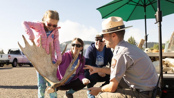 Ranger Sammy holds antlers