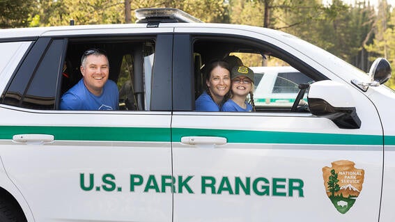 Ranger Sammy and family in Park Ranger SUV