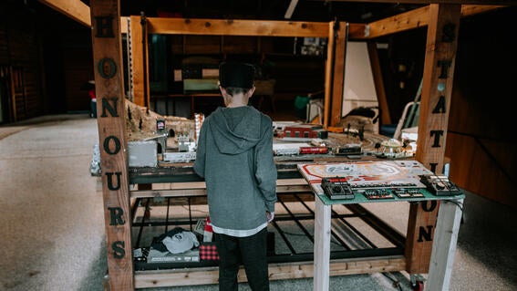 Honour standing in front of model trainset 