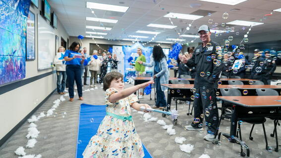 Girl playing with bubbles