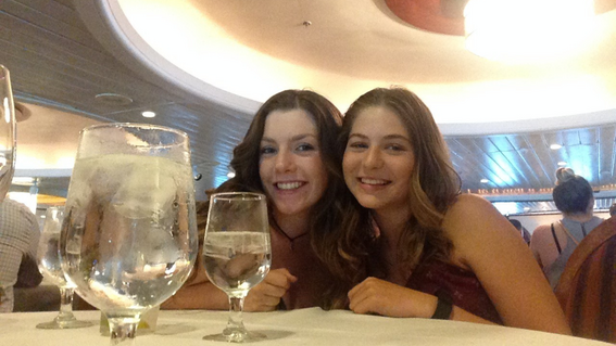 Isabella and her sister enjoying dinner during her wish to go on a cruise to The Bahamas, granted in 2016. 