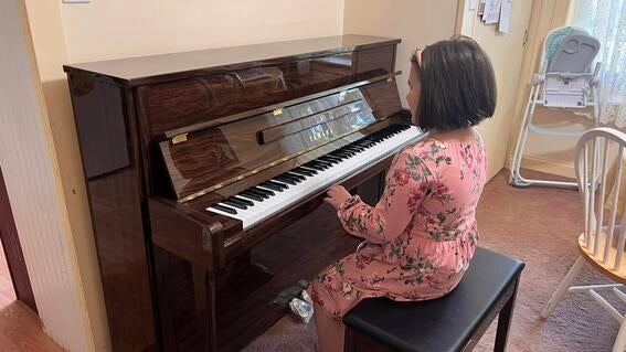 Paisley at the piano playing