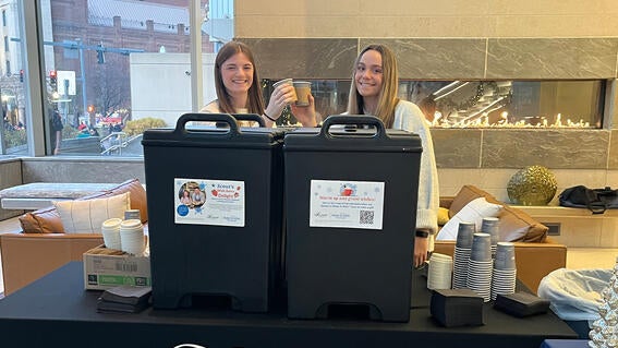 Youth Leadership Council members serving hot chocolate to help fund wishes.