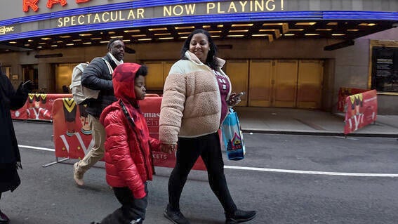 Austin and his Mom walking in NYC