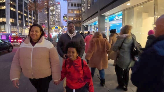 Austin and his family walking NYC