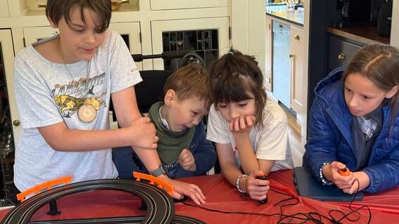 Corbett and his friends race cars