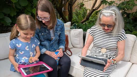 Participants learn about Pictello on the iPads