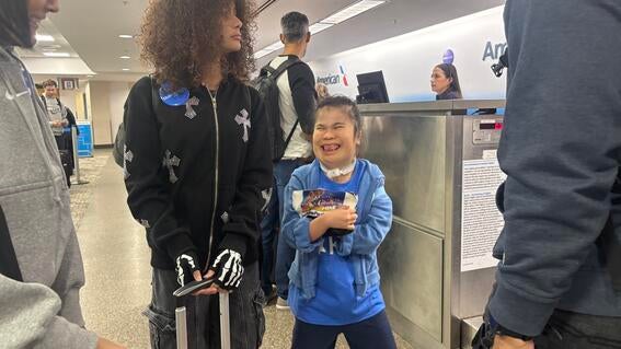 Wish kid Raina at the airport