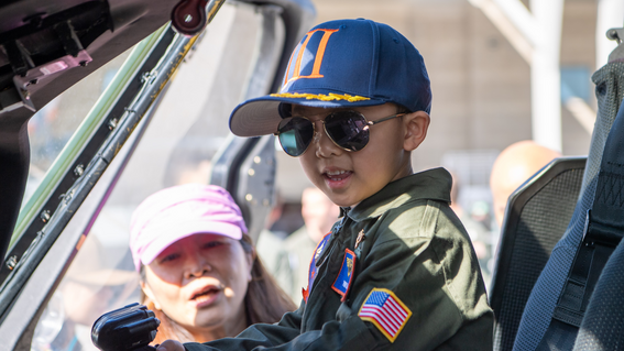Ringo gets an up‑close look inside a military helicopter as he tours the base.