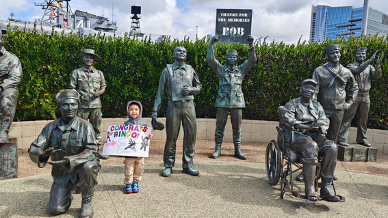 Ringo takes in the “National Salute to Bob Hope and the Military” statues along the waterfront at the USS Midway Museum.