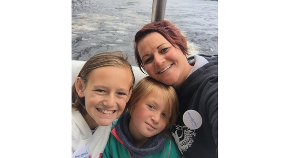 Daviney and her family on a boat