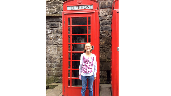 Daviney and in front of a phonebooth