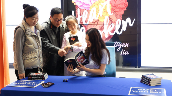 Ziyan with her family at her book signing and wish celebration.