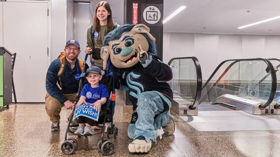 Caleb, his family and Buoy at the airport