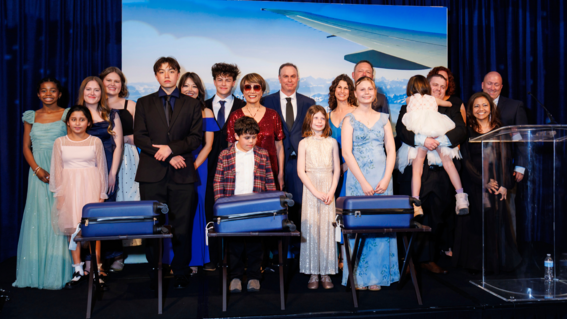 Wish kids and families on stage at Evening of Wishes: A World of Wishes