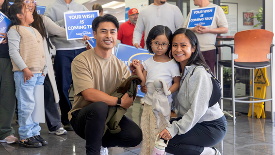Bella with her parents, learning her wish would be coming true, at Capital Subaru in San Jose