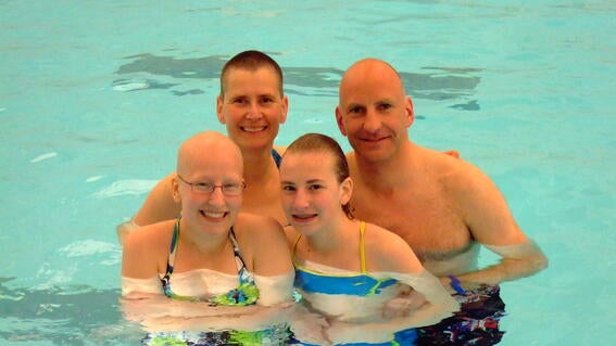 Lenka in the pool with family
