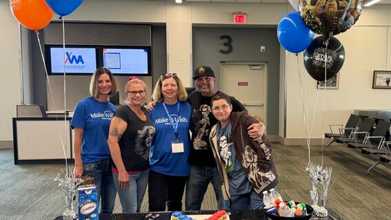 Wish kid Kenobi and his wish granters at his airport send-off.
