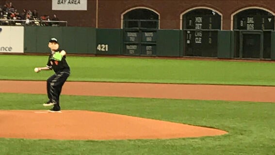 wish kid Ben throwing the first pitch