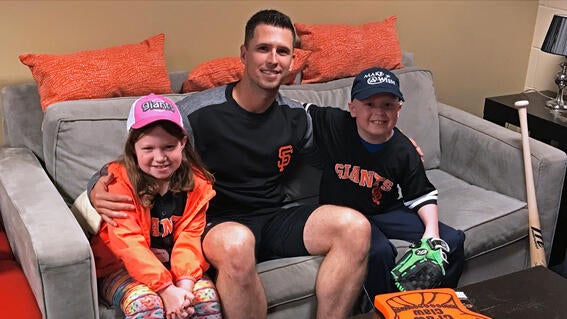 wish kid Ben and younger sister, Morgan, with Buster Posey