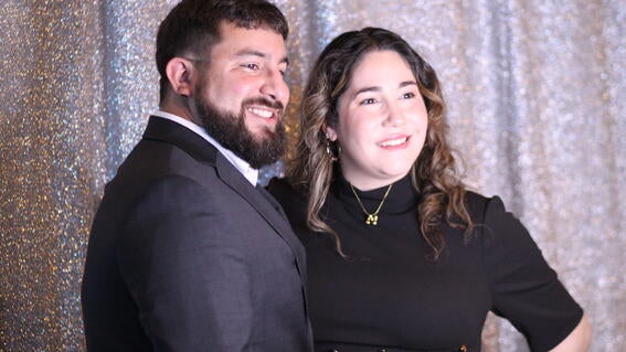 Evening of wishes attendees at photobooth smiling 