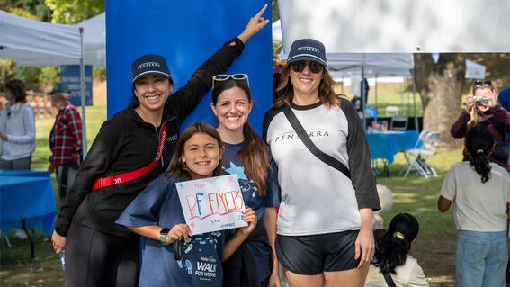 Team Penserra in front of the finish line at Walk for Wishes