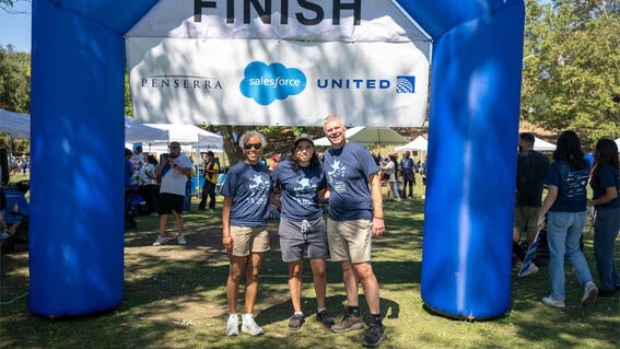 Team Bliss, a family of three, at the finish line