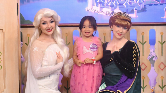 Wish kid Riley with Disney princesses 