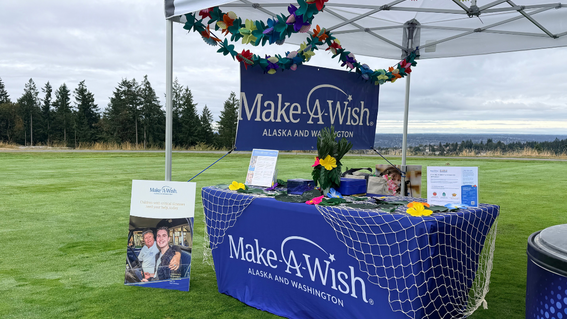 Make-A-Wish booth at Pacific Plumbing Supply Golf Tournament