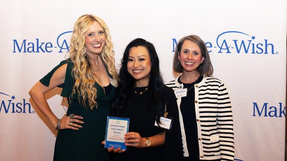Pictured from left to right: Leslie Noel-Hanson of the Peter Pan Foundation, Unlock Hope Innovation Award recipient Christine Eng, and wish mom Molly.