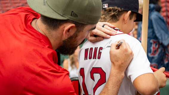 Connor Wong signing Matthew's jersey