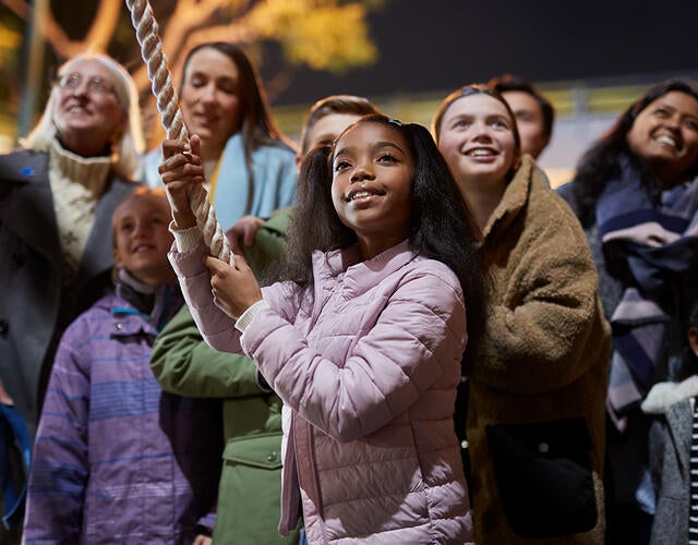 Young girl surrounded by community