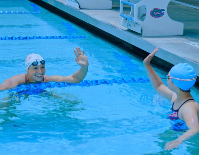 Wish kid Laura at wish experience with Katie Ledecky