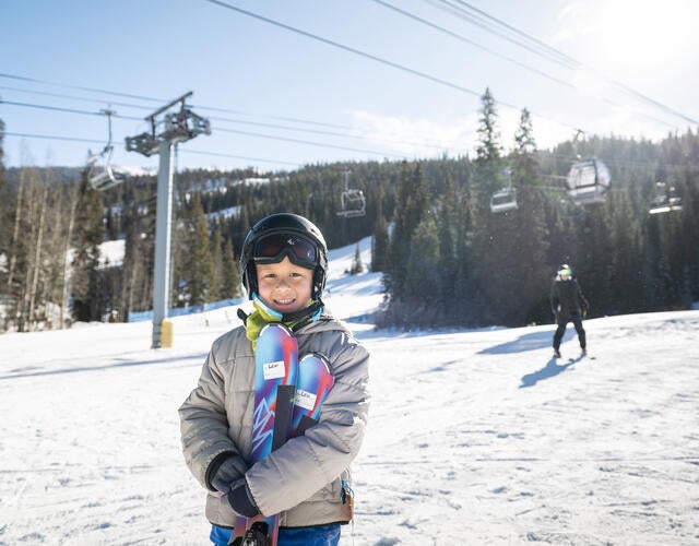 Wish kid Levi on the mountain for his skiing wish