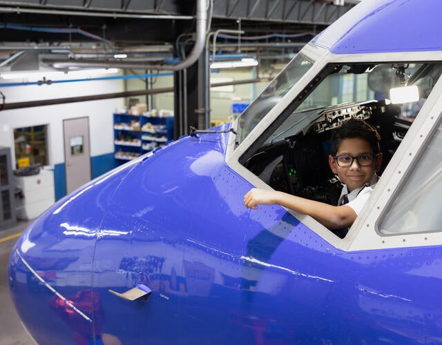 Wish kid Judah sitting in airplane 