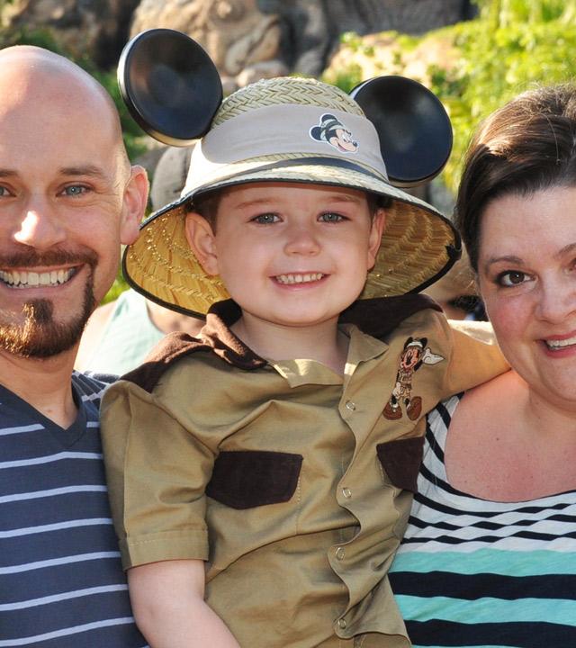 Bauer with his parents at Disneyland