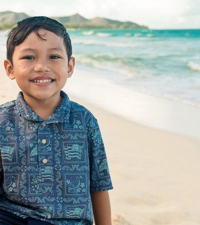 Wish kid Kanoa smiles at the beach