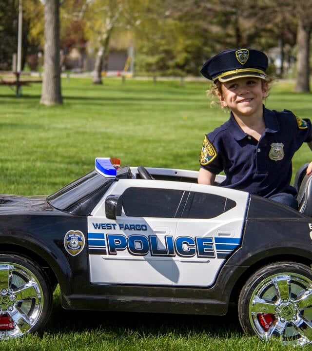 Kajj with mini police car