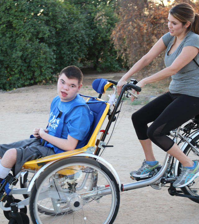 Brendan and his mom Natalie on his new adaptive bike