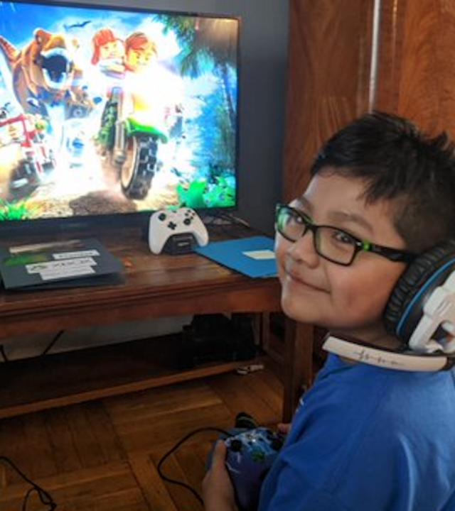Wish Kid Daniel playing Xbox