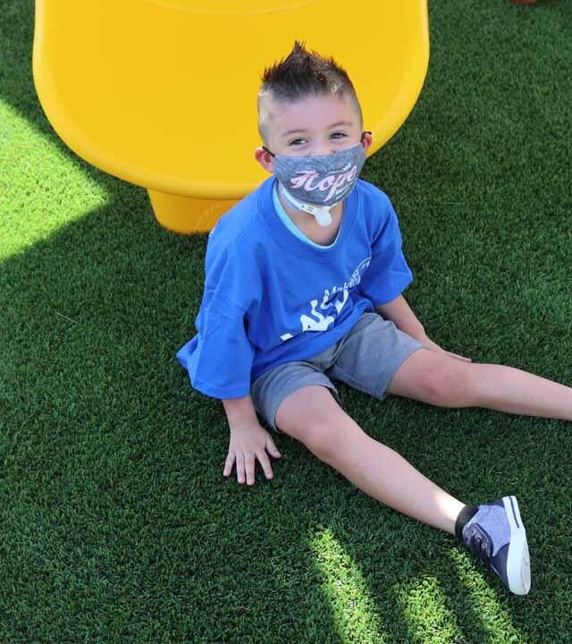 Ethan loves his new backyard wish playset. 