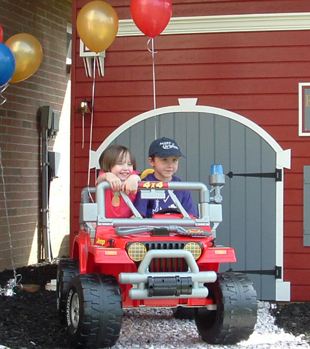 Six-year-old Ezra takes his Fire Rescue Jeep® for a spin around the block.