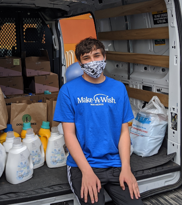 Wish kid Sam with his gift packages for healthcare workers