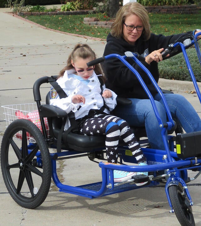 Emili and her mother on her bike