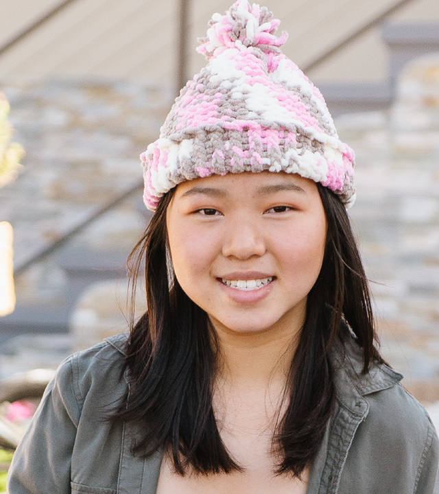 natalie poses in her hat