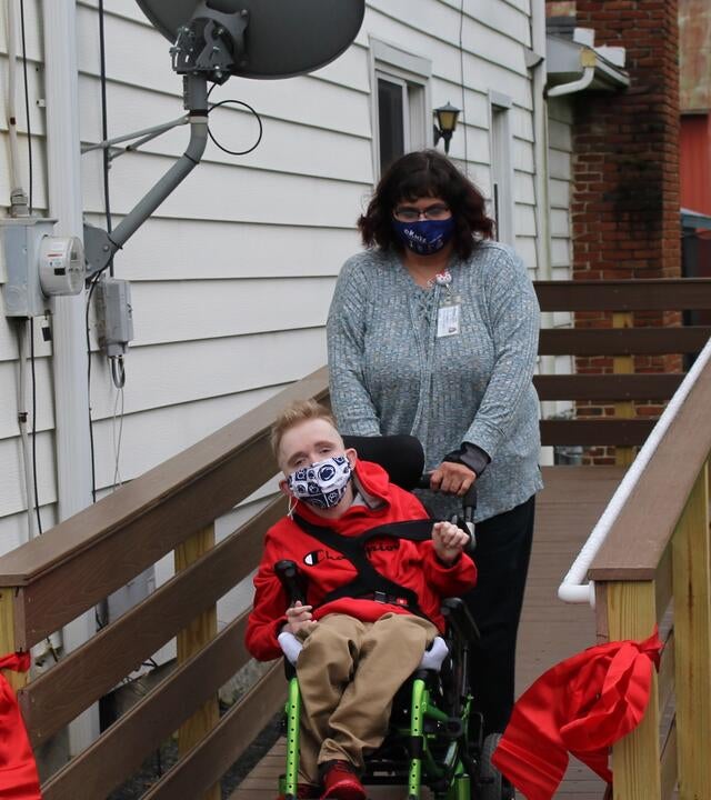 Collin on his new wheelchair ramp