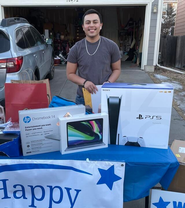 Marco standing in front of a table with his new PS5