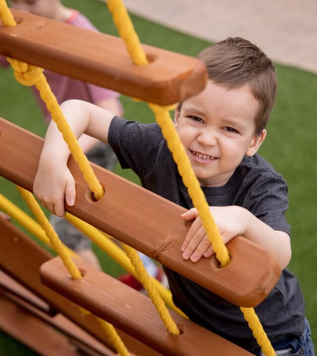 Teljn plays on his playset every day.